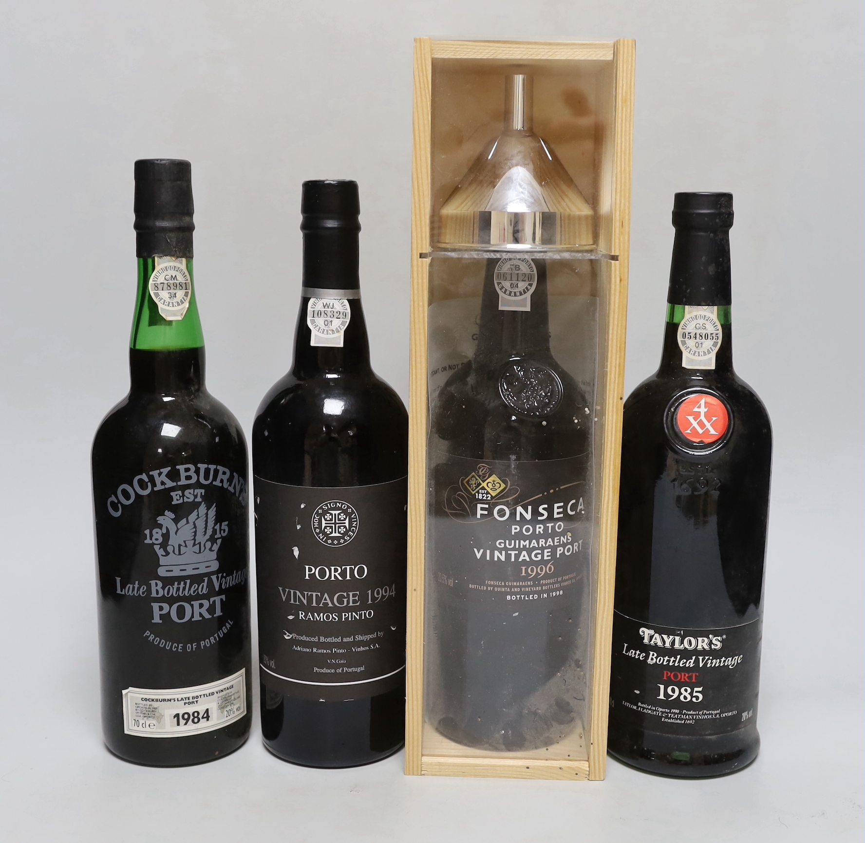 A bottle of cased Fonseca vintage port 1996, a Cockburn 1984, a Taylors 1985 and Ramos Pinto 1994